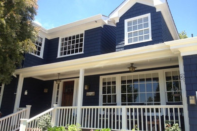 Inspiration for a large timeless blue two-story wood exterior home remodel in Los Angeles