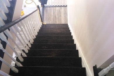 Example of a mid-sized classic wooden straight wood railing staircase design in Toronto with painted risers