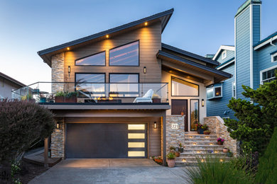 Example of a mid-sized trendy brown two-story exterior home design in San Francisco with a shed roof