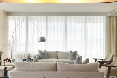 Inspiration for a large contemporary great room remodel in Other with beige walls