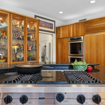 Luxury Mid-Century Kitchen with Custom Wood Cabinetry and Stone Countertops