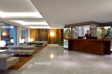 Example of a mid-sized trendy marble floor foyer design in Other with multicolored walls
