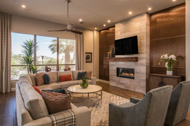 This is an example of a transitional family room in Phoenix.