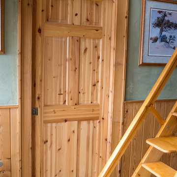 Knotty pine pocket door into the bathroom