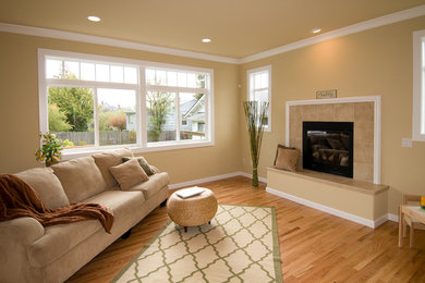 Living room - mid-sized contemporary open concept medium tone wood floor living room idea in Seattle with beige walls, a ribbon fireplace and a tile fireplace