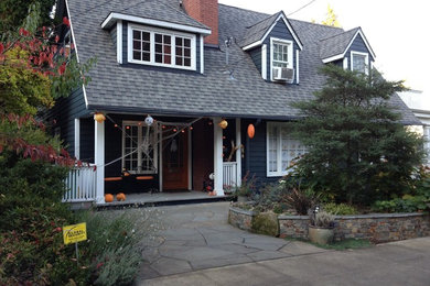 Design ideas for a large arts and crafts two-storey grey exterior in Portland with wood siding.
