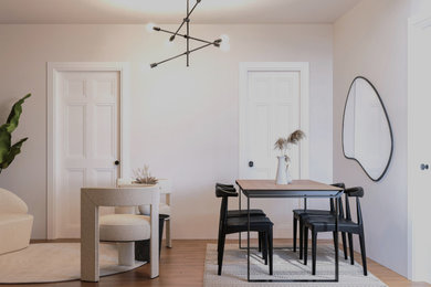 Design ideas for a small scandinavian dining room in New York with dark hardwood flooring.