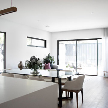 The Living Room's white colour palette is accentuated by the striking black trim