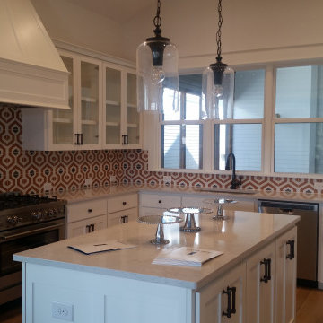 Full View of Kitchen with honeycomb Tile and Cabnetry