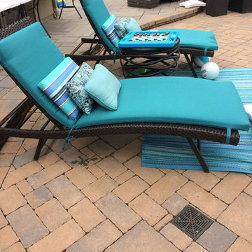 Outdoor living space with pool and sunken bar, plus cabana