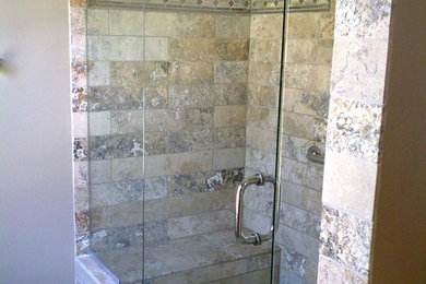 Transitional travertine tile travertine floor bathroom photo in Cincinnati with furniture-like cabinets, light wood cabinets and granite countertops