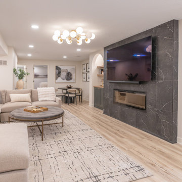 Warm & Inviting Basement Retreat with Custom Bar + Entertainment Center