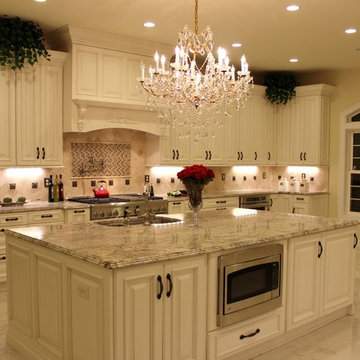 Luxurious Kitchen w/Antique White Cabinetry & Sienna Bordeaux Granite Countertop