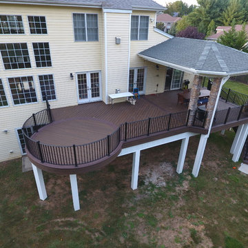 State of the Art Trex Deck, Curved Stairs, Hip-Roof