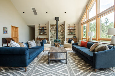 Inspiration for a mid-sized rustic formal and open concept living room remodel in Denver with white walls, a wood stove and no tv