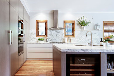 Design ideas for a large transitional l-shaped open plan kitchen in Sydney with an undermount sink, light wood cabinets, marble benchtops, multi-coloured splashback, marble splashback, panelled appliances, medium hardwood floors, with island, multi-coloured floor and multi-coloured benchtop.