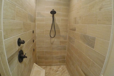 Trendy beige tile and multicolored tile ceramic tile and multicolored floor bathroom photo in Other with beige walls