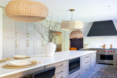 Inspiration for a large transitional u-shaped slate floor and gray floor open concept kitchen remodel in Philadelphia with an undermount sink, recessed-panel cabinets, marble countertops, white backsplash, ceramic backsplash, stainless steel appliances, an island, white countertops and light wood cabinets