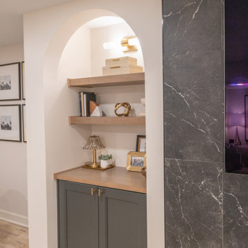 Warm & Inviting Basement Retreat with Custom Bar + Entertainment Center