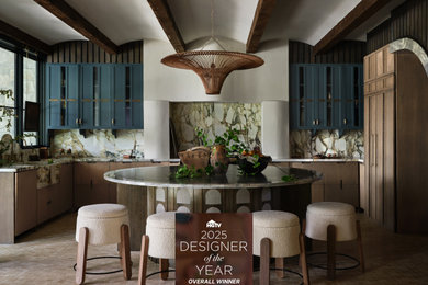 Mid-sized transitional l-shaped brown floor enclosed kitchen photo with a farmhouse sink, shaker cabinets, distressed cabinets, multicolored backsplash, stone slab backsplash and paneled appliances
