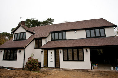 Photo of a traditional two floor render detached house in Hertfordshire with a pitched roof.