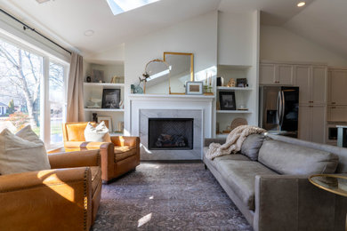 Inspiration for a mid-sized transitional open concept vaulted ceiling, dark wood floor and brown floor living room remodel in Charlotte with beige walls, a standard fireplace, a stone fireplace and no tv
