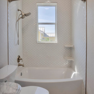 Coastal Bath with Fish Scale Tile Surround