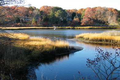 Example of a beach style home design design in Boston