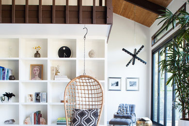 Inspiration for a large scandinavian open concept dark wood floor living room library remodel in San Francisco with white walls