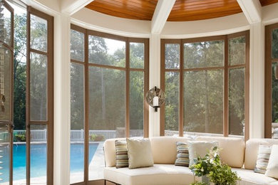 This is an example of a traditional stone porch design in Other with a roof extension.