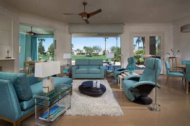 Example of a mid-sized trendy open concept light wood floor and brown floor living room design in Orange County with beige walls, a ribbon fireplace, a media wall and a tile fireplace