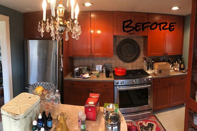 Kitchen - transitional kitchen idea in New York with recessed-panel cabinets and brown cabinets