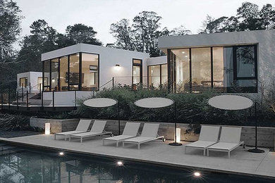 Large minimalist white one-story stucco exterior home photo in San Francisco