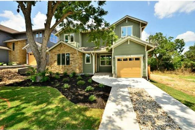 Mid-sized arts and crafts green two-story concrete fiberboard gable roof photo in Austin