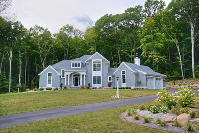 Mid-sized transitional gray two-story wood exterior home idea in New York