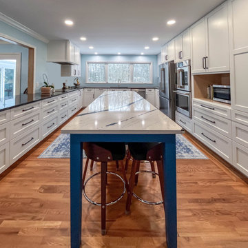 Kitchen with White Perimeter and Blue Island Cabinet Reface