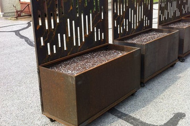 Corten steel planters with decorative laser cut corten steel privacy screens