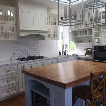White hardwood kitchen cabinet with mirror grated doors-this style is popular in