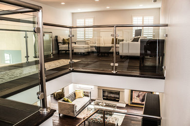 Example of a mid-sized trendy loft-style and formal dark wood floor living room design in Los Angeles with a standard fireplace