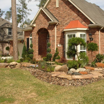 Landscaping with oversize pavers and backyard creek - hkns