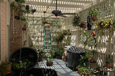 Island style patio photo in Miami