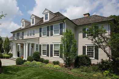 Inspiration for a timeless gray concrete fiberboard exterior home remodel in Philadelphia with a hip roof
