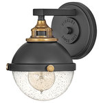 Hinkley Lighting - Fletcher Wall Sconce in Black - Fletcher's chic vibe transcends style boundaries. A seamless dome shade features a cast-fitter and an elegant capture ring that secures the clear seedy glass with decorative cast knobs. Spanning vintage to industrial classic to transitional Fletcher seamlessly unifies any decor declaration. Its two-tone finishes come in Polished Nickel with Heritage Brass or Black with Heritage Brass.