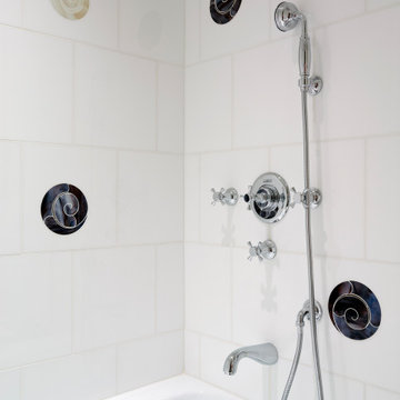 Mosaic tile inlays detail this shower