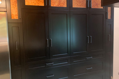 Enclosed kitchen - small transitional u-shaped ceramic tile and multicolored floor enclosed kitchen idea in Indianapolis with a double-bowl sink, recessed-panel cabinets, black cabinets, quartz countertops, gray backsplash, ceramic backsplash, stainless steel appliances, a peninsula and gray countertops