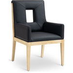 Meridian Furniture - Gwendolyn Upholstered Dining Arm Chair, Black, Vegan Leather, Natural Finish - A masterpiece of modern elegance and comfort, the Gwendolyn black vegan leather dining armchair is where modern design meets timeless charm. Designed with comfort in mind, it features a high back and luxurious cushioning, perfect for long dinners or lively gatherings. The natural oak wood frame adds a rustic touch, effortlessly balancing the contemporary fabric with a hint of warmth and tradition.