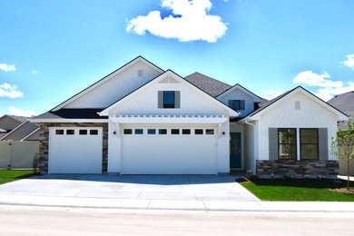 Inspiration for a mid-sized transitional white one-story mixed siding exterior home remodel in Boise with a shingle roof