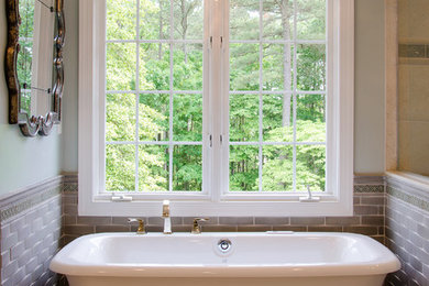 Example of a large transitional master beige tile and porcelain tile porcelain tile bathroom design in Richmond with raised-panel cabinets, gray cabinets, a two-piece toilet, green walls, an undermount sink and quartz countertops