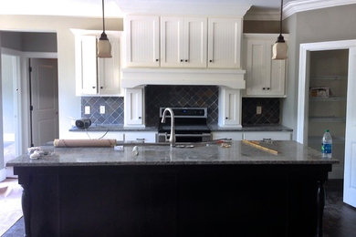 Painted White Cabinets w/ Decorative Hood and Dark Stained Isaland