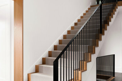 Inspiration for a mid-sized contemporary wooden straight metal railing staircase remodel in Chicago with wooden risers